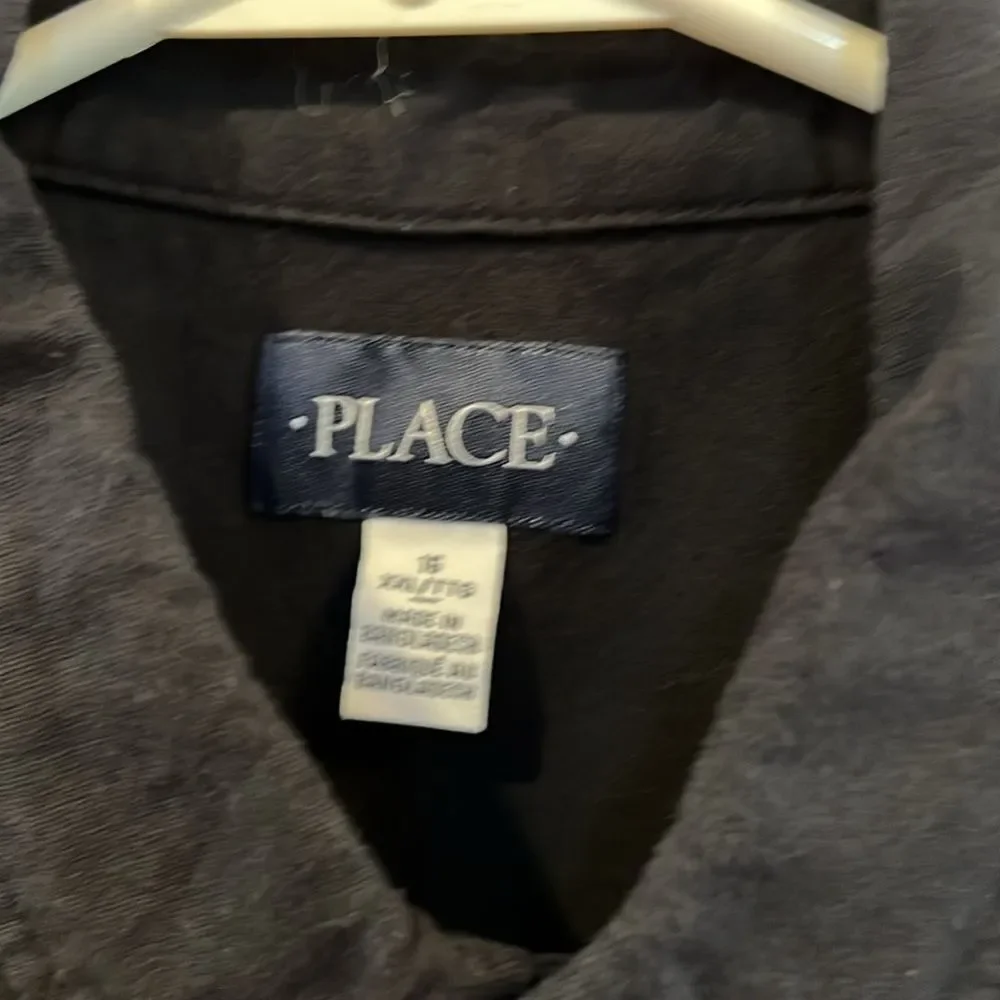 The Childrens Place youth boys size 16 black button down shirt.